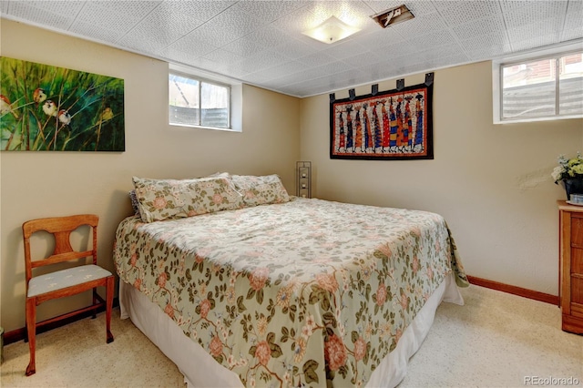bedroom featuring carpet flooring and baseboards