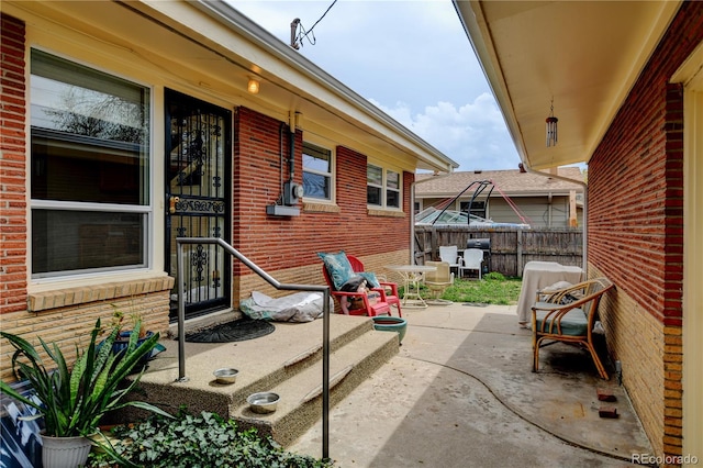 view of patio with fence