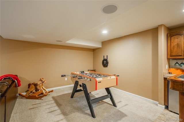 rec room featuring light carpet, baseboards, and recessed lighting