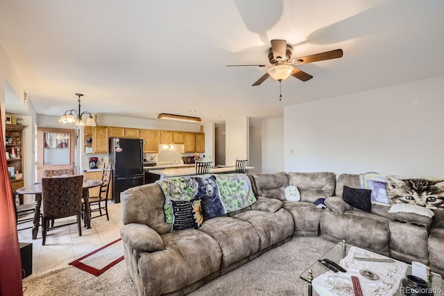 living room with ceiling fan with notable chandelier and light tile patterned flooring