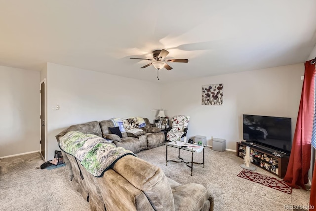 living area featuring a ceiling fan, carpet flooring, and baseboards