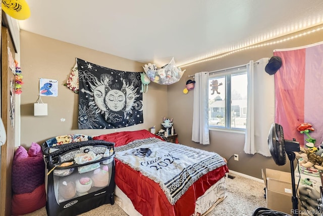 carpeted bedroom with baseboards