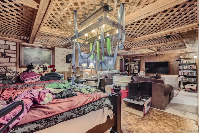 bedroom featuring wood walls