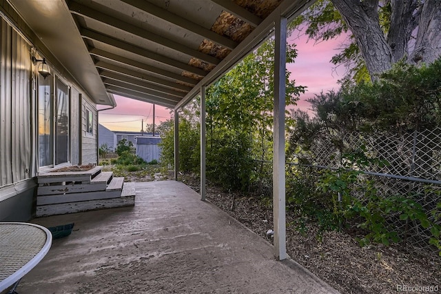 view of patio terrace at dusk