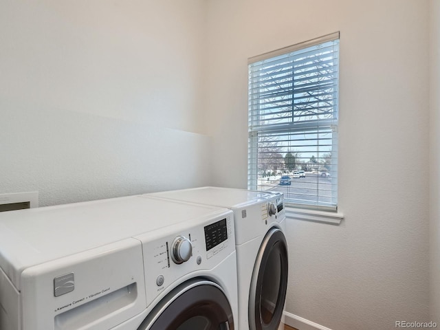 laundry room with washing machine and dryer