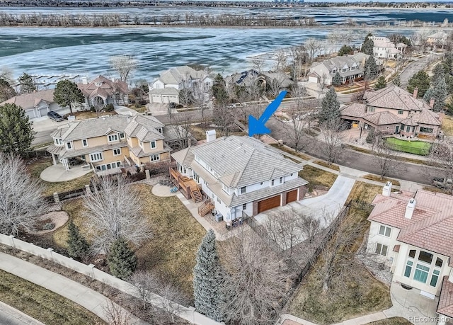 aerial view with a water view and a residential view