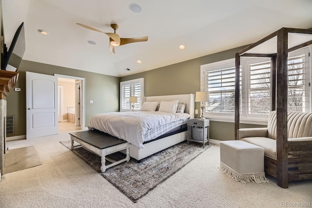 bedroom with light carpet, multiple windows, vaulted ceiling, and recessed lighting