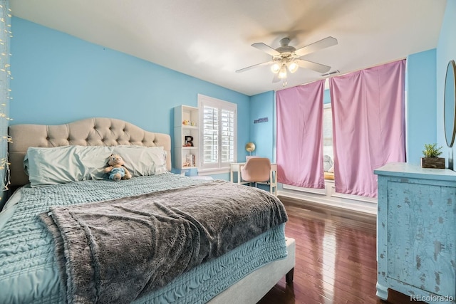 bedroom featuring hardwood / wood-style floors and a ceiling fan