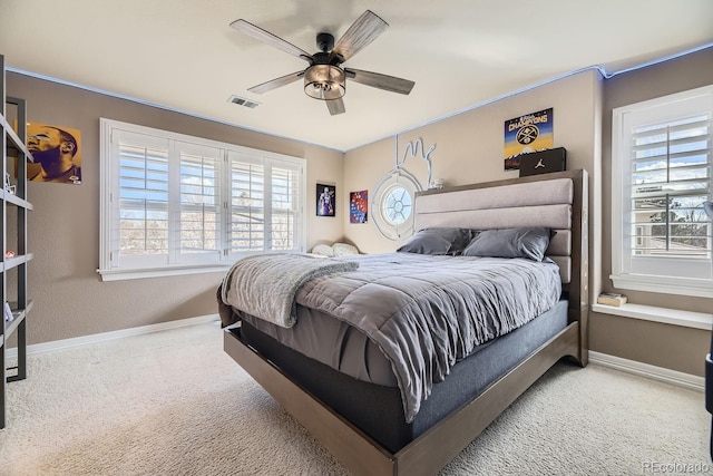 bedroom featuring carpet floors, visible vents, ceiling fan, and baseboards