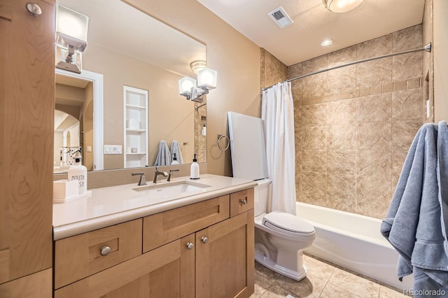 bathroom featuring visible vents, toilet, shower / tub combo with curtain, tile patterned flooring, and vanity