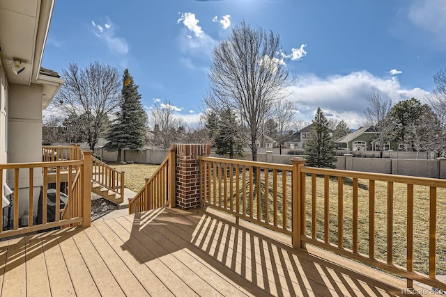 wooden terrace featuring a fenced backyard