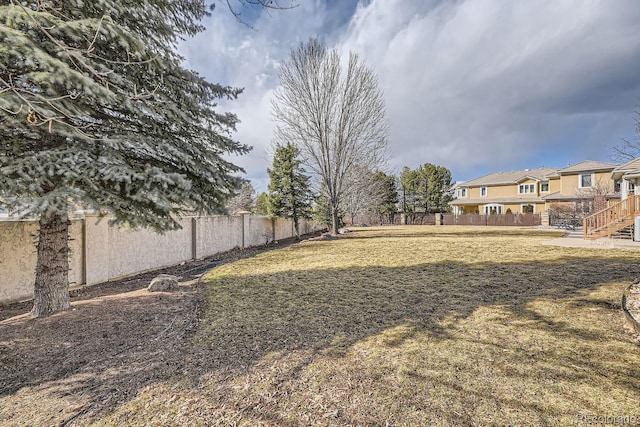 view of yard with a fenced backyard