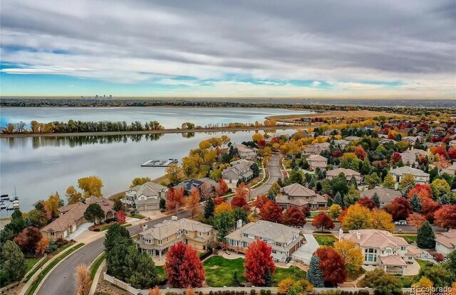 bird's eye view with a residential view and a water view