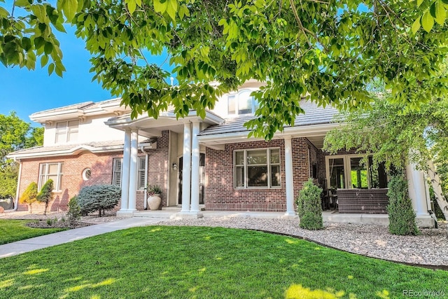 6790 W Crestline Ave, Littleton, CO 80123 - view of front of home featuring a front yard and brick siding