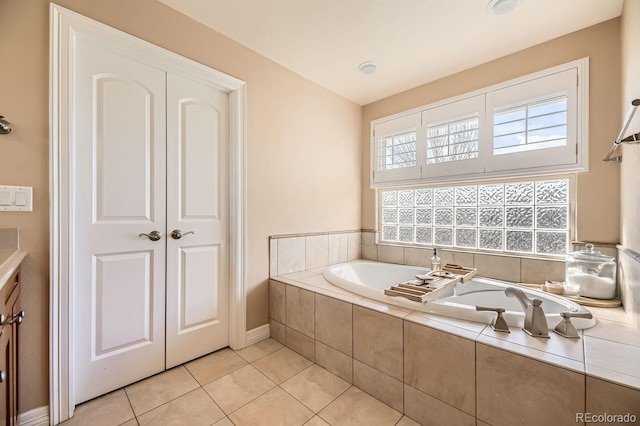 6790 W Crestline Ave, Littleton, CO 80123 - bathroom featuring a garden tub, tile patterned floors, and baseboards