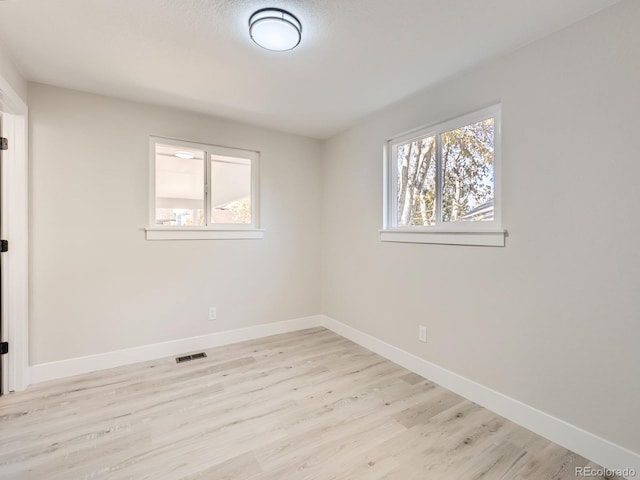 unfurnished room featuring light hardwood / wood-style flooring