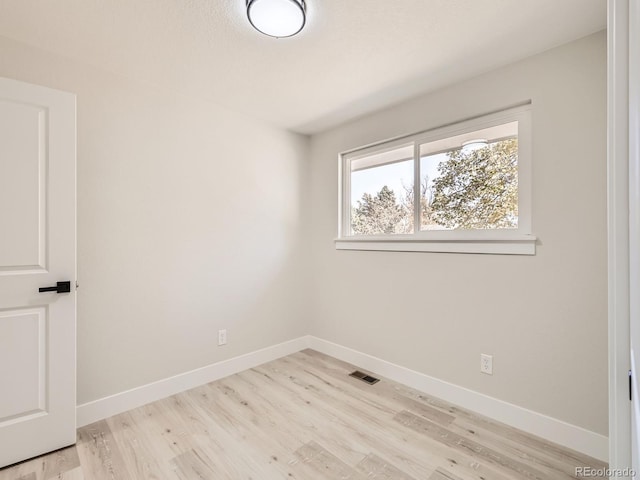 empty room with light wood-type flooring