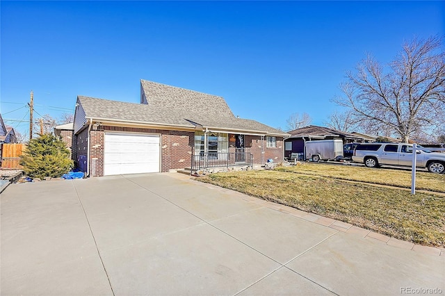 ranch-style house featuring a porch, a garage, and a front yard