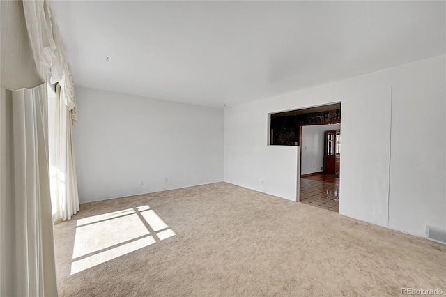 5621 Demott Ave, Commerce City, CO 80022 - spare room with light colored carpet