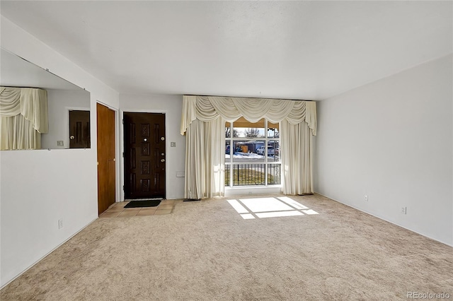 5621 Demott Ave, Commerce City, CO 80022 - unfurnished living room featuring light colored carpet