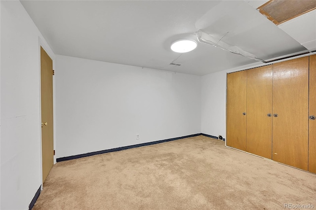 5621 Demott Ave, Commerce City, CO 80022 - unfurnished bedroom with light colored carpet and a closet