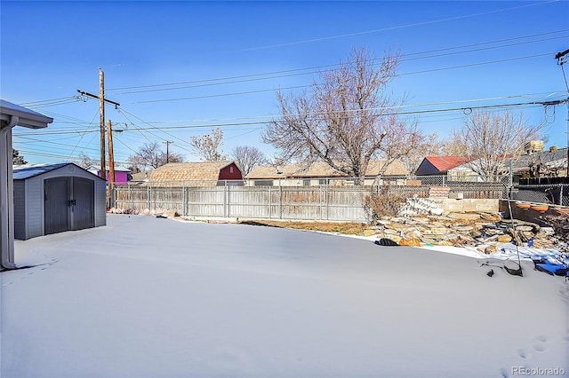 5621 Demott Ave, Commerce City, CO 80022 - snowy yard with a storage shed
