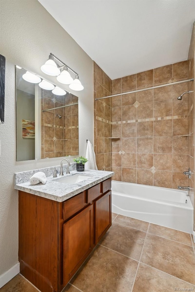3482 E 28th Ave, Denver, CO 80205 - full bath featuring shower / tub combination, vanity, a textured wall, and tile patterned flooring