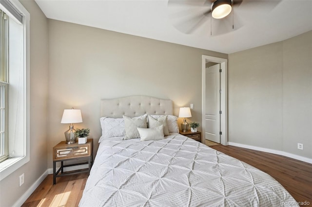3482 E 28th Ave, Denver, CO 80205 - bedroom featuring wood finished floors, baseboards, and a ceiling fan