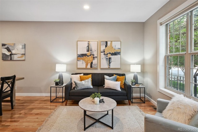 3482 E 28th Ave, Denver, CO 80205 - living room with wood finished floors, baseboards, and recessed lighting
