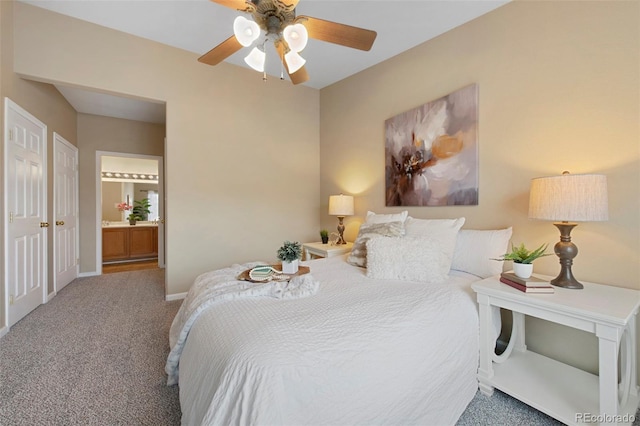 carpeted bedroom featuring ceiling fan and connected bathroom