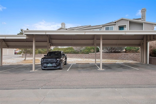 view of parking / parking lot with a carport