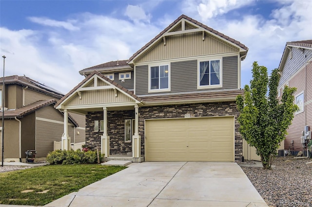 5010 Eaglewood Ln, Johnstown, CO 80534 - craftsman inspired home with stone siding, a garage, concrete driveway, board and batten siding, and a tiled roof