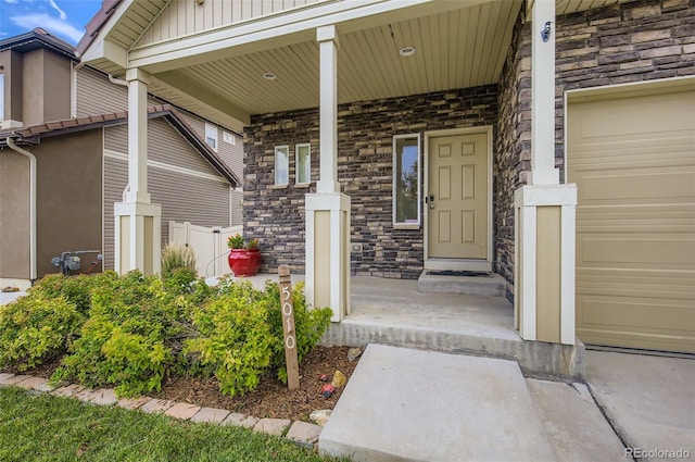 5010 Eaglewood Ln, Johnstown, CO 80534 - property entrance with stone siding, covered porch, board and batten siding, and a garage
