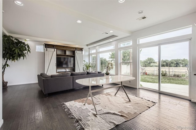 5010 Eaglewood Ln, Johnstown, CO 80534 - living room featuring dark wood-type flooring, recessed lighting, and a barn door