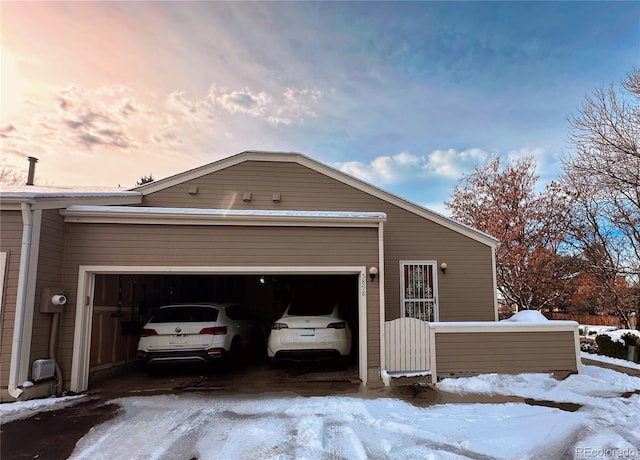 view of snow covered garage