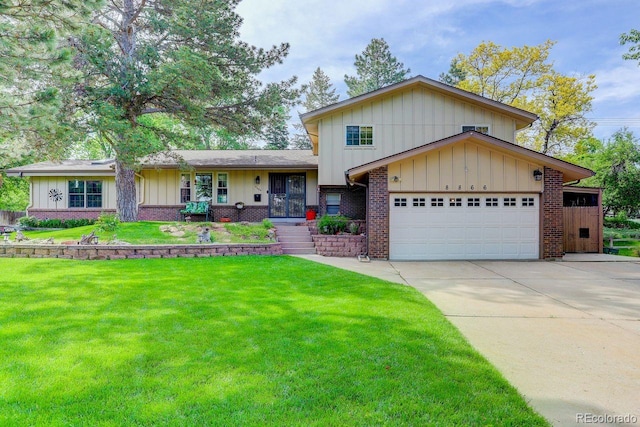 8866 E Easter Ave, Centennial, CO 80112 - split level home featuring brick siding, an attached garage, a front yard, board and batten siding, and concrete driveway