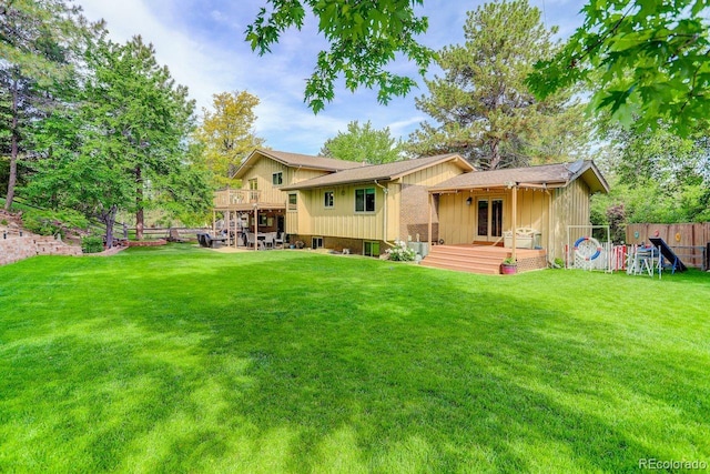 8866 E Easter Ave, Centennial, CO 80112 - rear view of property with a wooden deck and board and batten siding