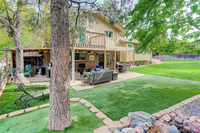 8866 E Easter Ave, Centennial, CO 80112 - rear view of property featuring an outdoor hangout area, a patio, brick siding, board and batten siding, and ceiling fan