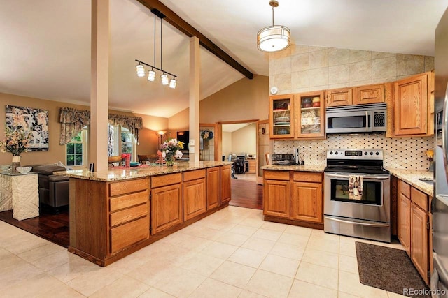 8866 E Easter Ave, Centennial, CO 80112 - kitchen with appliances with stainless steel finishes, brown cabinets, light tile patterned floors, and light stone counters