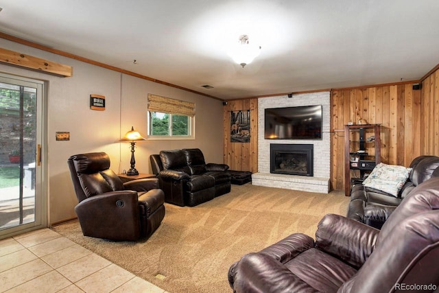 8866 E Easter Ave, Centennial, CO 80112 - living room featuring ornamental molding, wood walls, a brick fireplace, and tile patterned floors