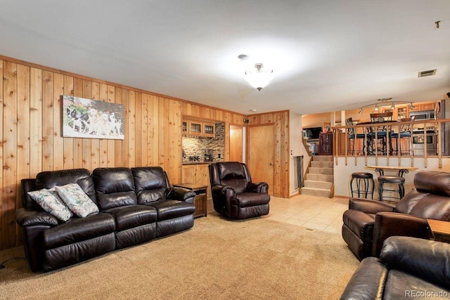 8866 E Easter Ave, Centennial, CO 80112 - carpeted living area with stairs, wood walls, and tile patterned flooring