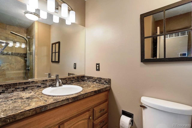 8866 E Easter Ave, Centennial, CO 80112 - bathroom with toilet, vanity, and tiled shower
