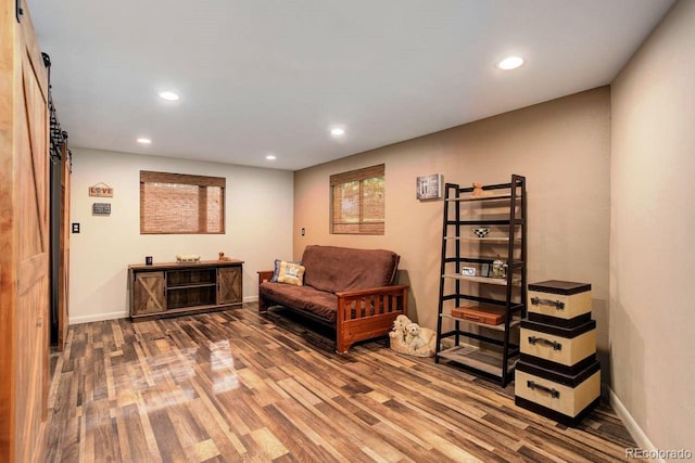 8866 E Easter Ave, Centennial, CO 80112 - sitting room featuring wood finished floors, recessed lighting, baseboards, and a barn door
