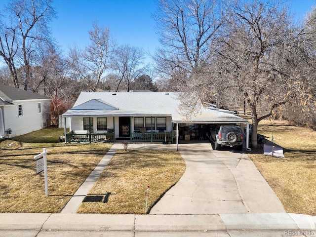 view of front of home with a porch, a garage, and a front yard