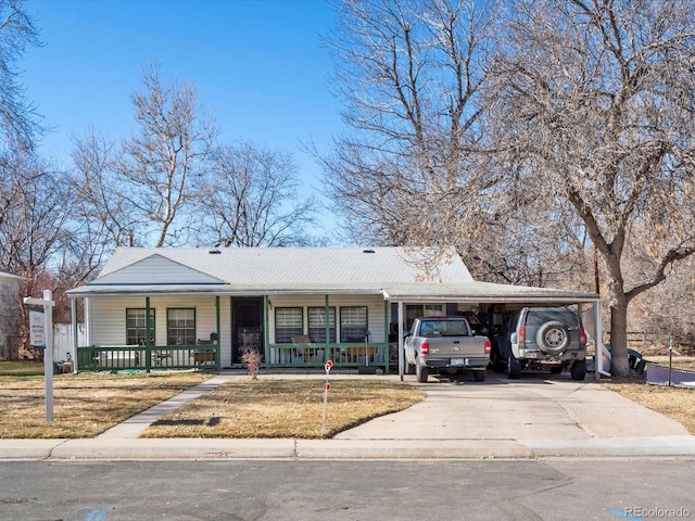 view of front of property featuring a carport and covered porch