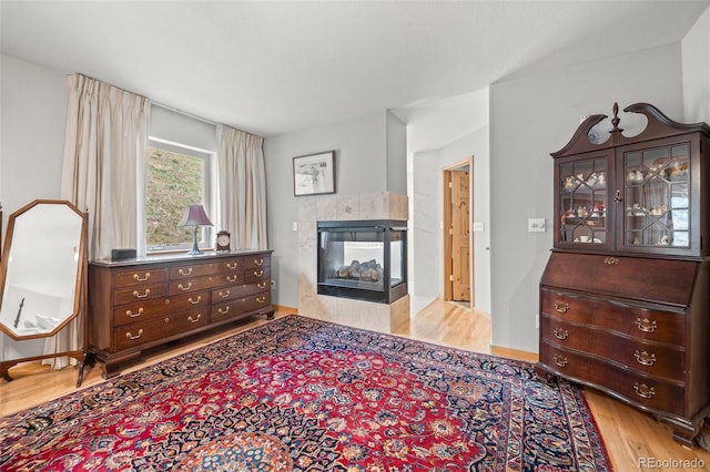 32209 Blue Springs Dr, Evergreen, CO 80439 - living area with wood finished floors and a tile fireplace