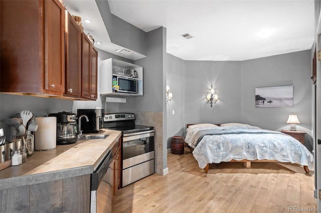32209 Blue Springs Dr, Evergreen, CO 80439 - bedroom with a sink and light wood-style floors