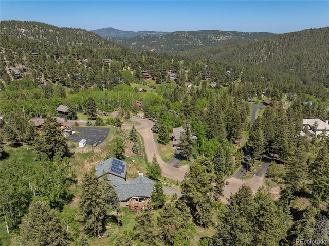 32209 Blue Springs Dr, Evergreen, CO 80439 - aerial view of property's location with a heavily wooded area and mountains