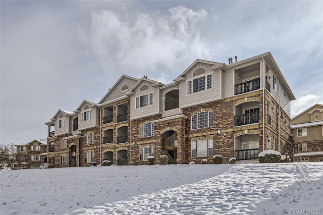 view of front of home featuring brick siding