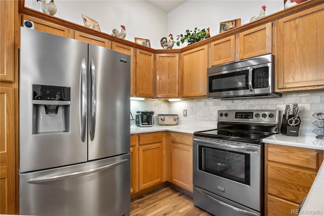 8944 Fox Dr Unit 6-103, Denver, CO 80260 - kitchen with stainless steel appliances, light countertops, and backsplash
